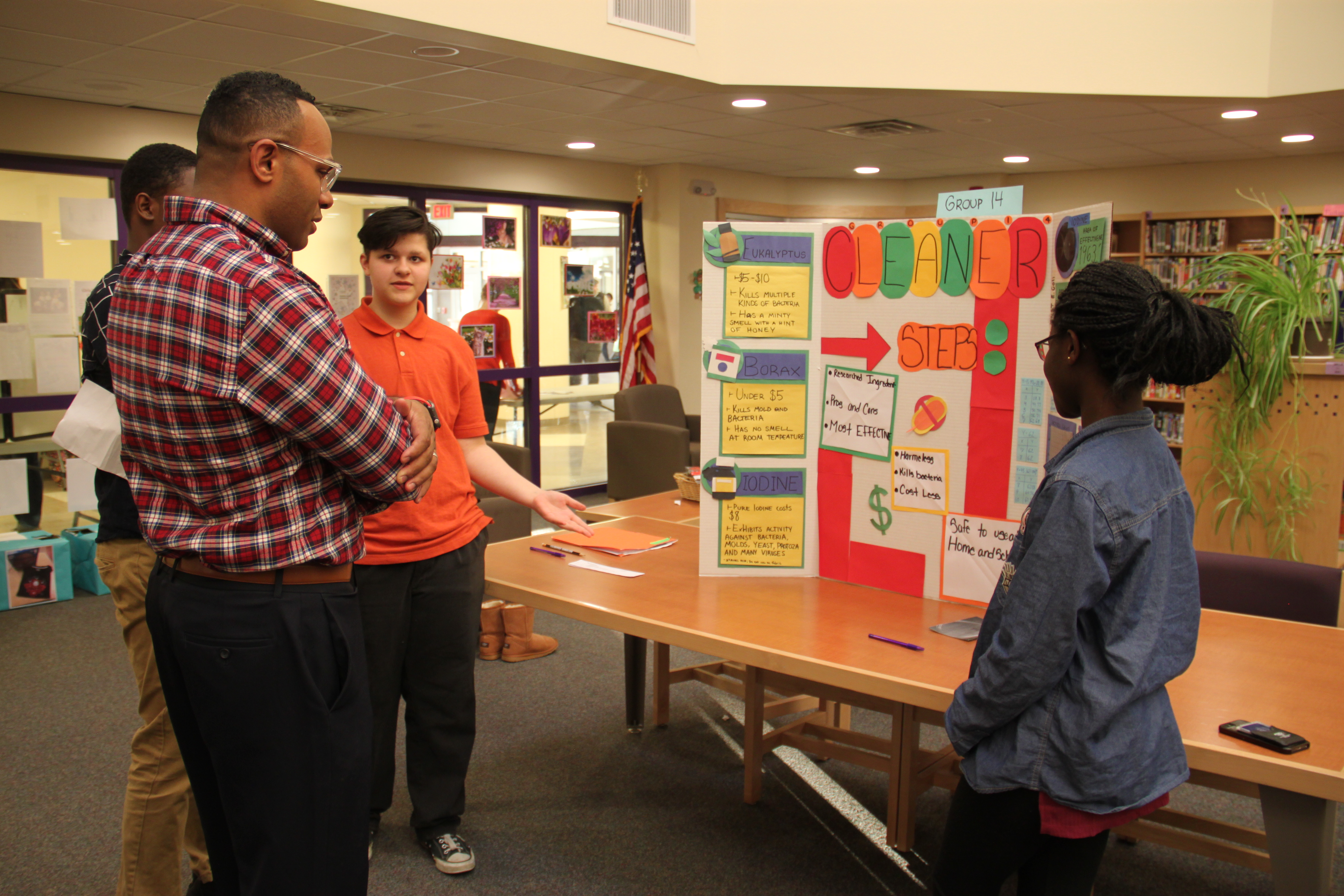 P-TECH students present their findings to Dr. Casey Parker