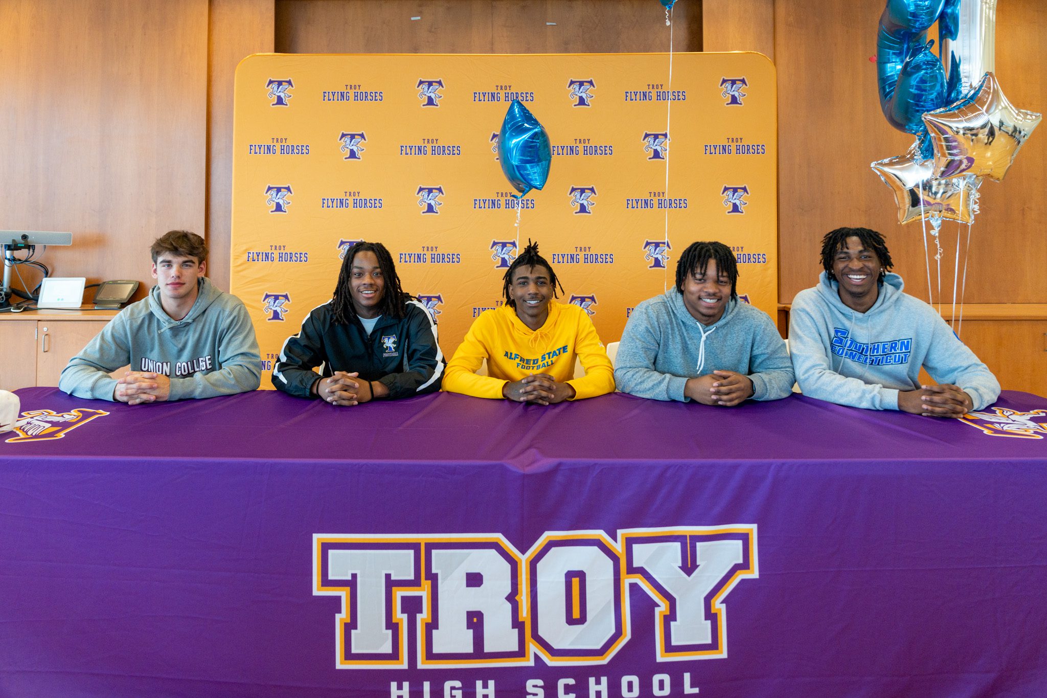 varsity-football-players-commit-to-play-in-college-troy-city-school